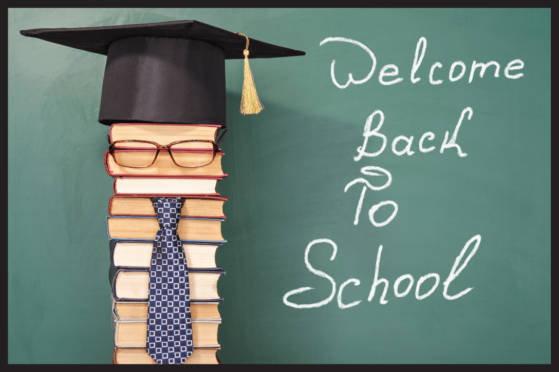 Welcome Back to School cursive written on a blackboard.